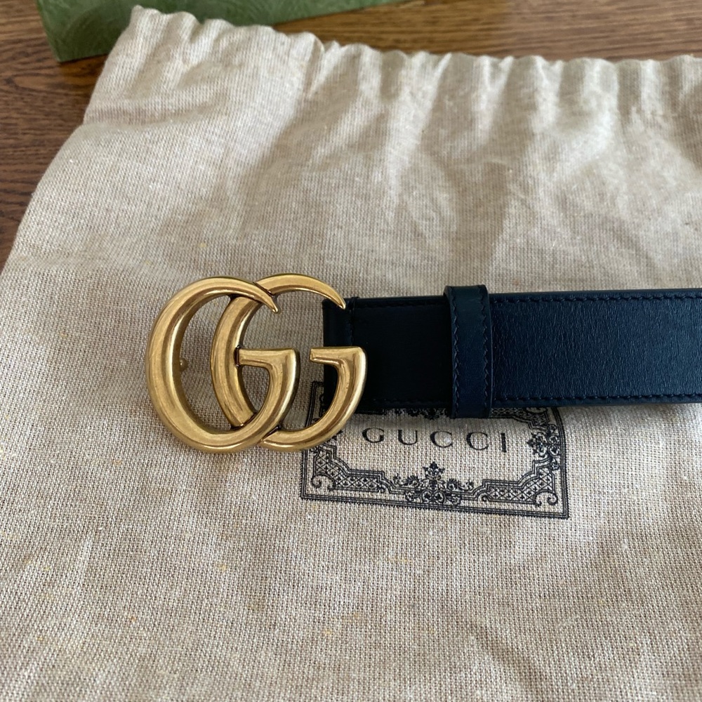 Authentic Gucci GG black and gold belt.